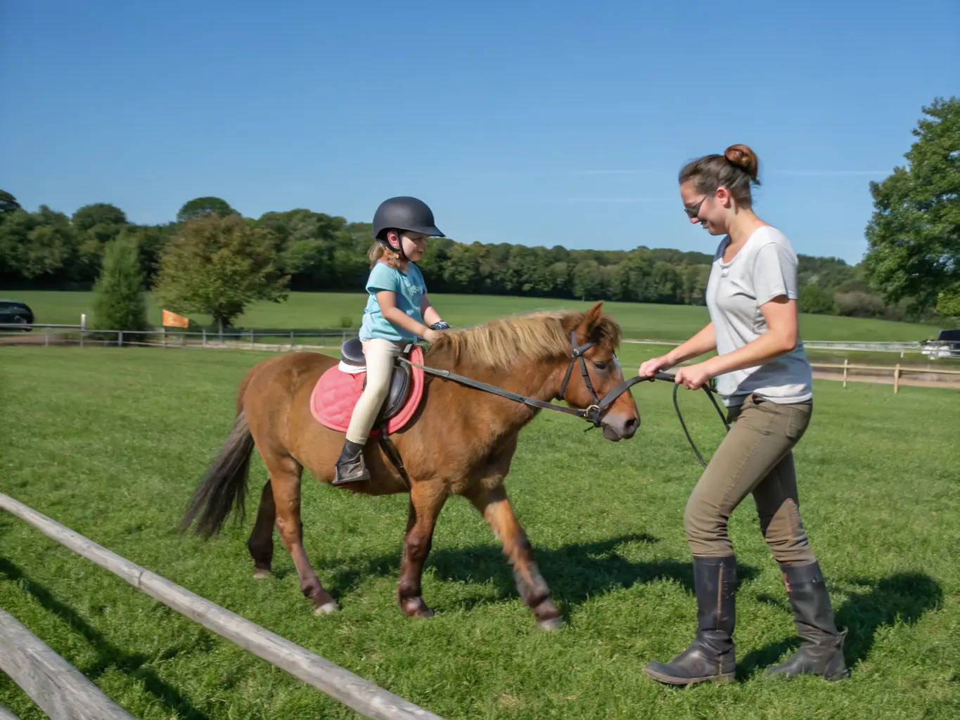 An image of riders in training sessions with instructors guiding them on horseback in a lush outdoor arena, showcasing CDEA's Equestrian Training Programs.